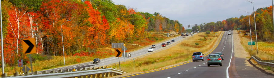 Divided highway with traffic in the fall, Canada