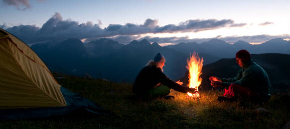 couple tent camping in the wilderness