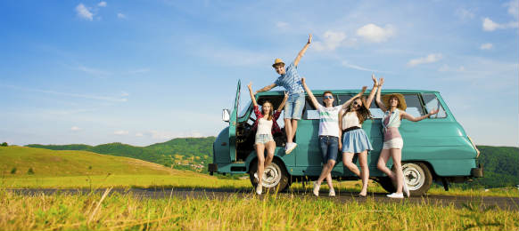 young hipster friends on road trip