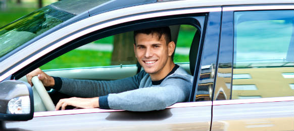 young man in his car rental